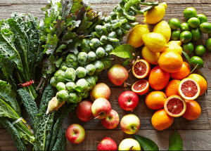 a group of fruits and vegetables on a wood surface Healthy Weight Loss Diets Banstead